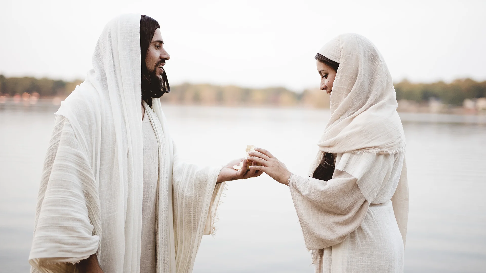 jesus-christ-giving-piece-bread-female-wearing-biblical-robe