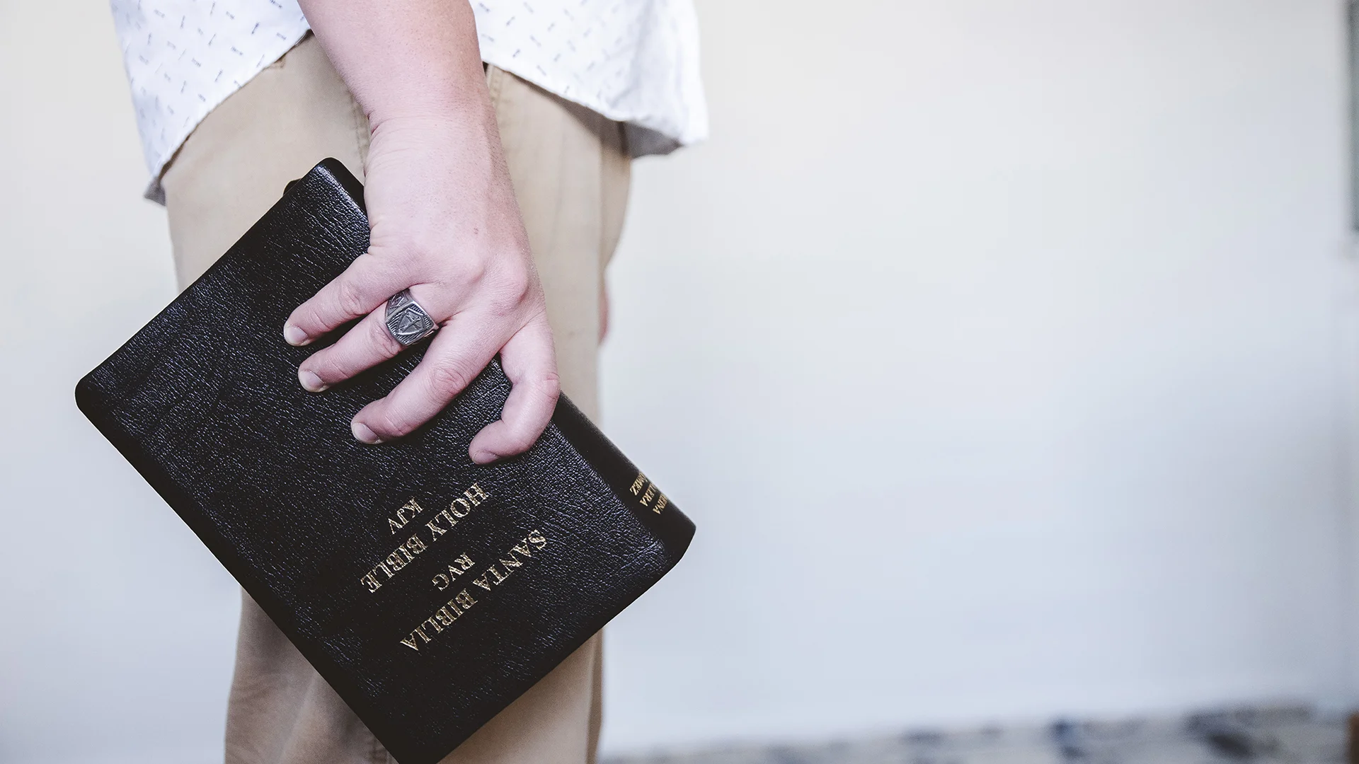 Male holding the Bible